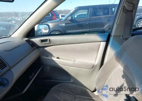 2003 Toyota Camry Le z USA, uszkodzony, nr VIN JTDBE32KX30233253